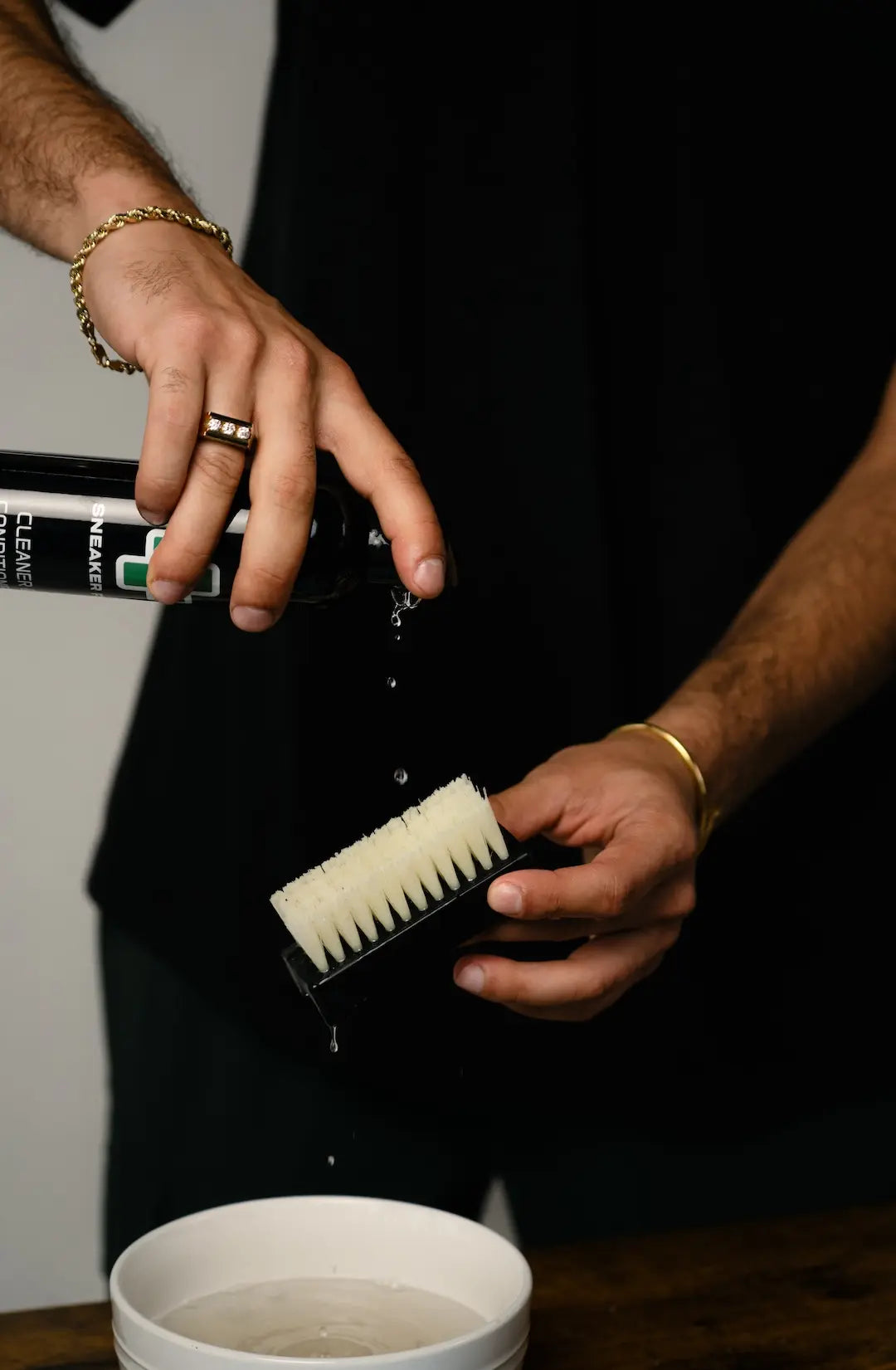 Sneaker Fix Cleaner & Conditioner shoe cleaner being spilled on a brush